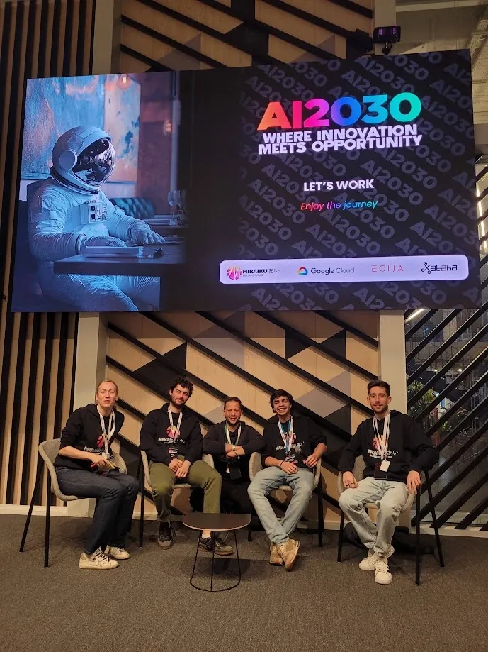 Five members of the Miraiku team seated on stage at AI2030, under a screen reading Where innovation meets opportunity